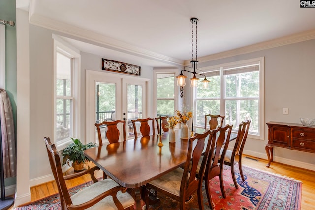 570 Wateree Key Ct, Winnsboro, SC 29180 - dining space with crown molding, plenty of natural light, light wood-style flooring, and baseboards