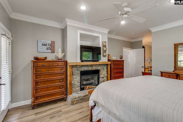 570 Wateree Key Ct, Winnsboro, SC 29180 - bedroom with light wood-type flooring, a fireplace, ornamental molding, baseboards, and recessed lighting