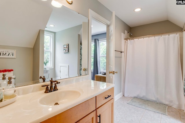 570 Wateree Key Ct, Winnsboro, SC 29180 - bathroom featuring lofted ceiling, tile patterned floors, vanity, plenty of natural light, and a shower with curtain