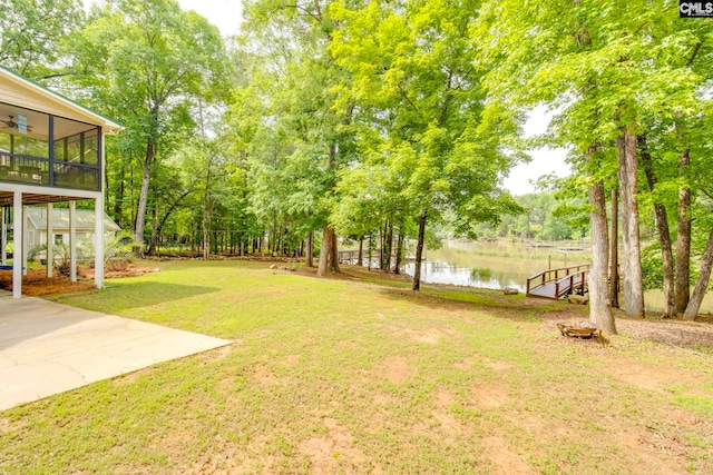 570 Wateree Key Ct, Winnsboro, SC 29180 - view of grassy yard with a water view, a sunroom, and a ceiling fan