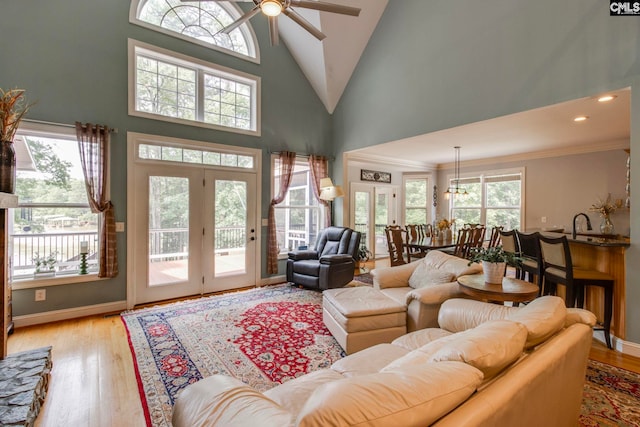 570 Wateree Key Ct, Winnsboro, SC 29180 - living area featuring a ceiling fan, light wood-style flooring, high vaulted ceiling, ornamental molding, and a chandelier
