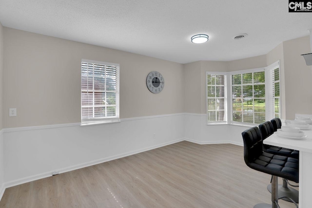 3102 Travis Ct, Columbia, SC 29204 - unfurnished office featuring wood finished floors, baseboards, and a textured ceiling