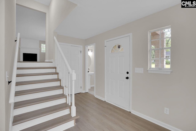3102 Travis Ct, Columbia, SC 29204 - foyer entrance featuring light wood-style floors, baseboards, and stairway