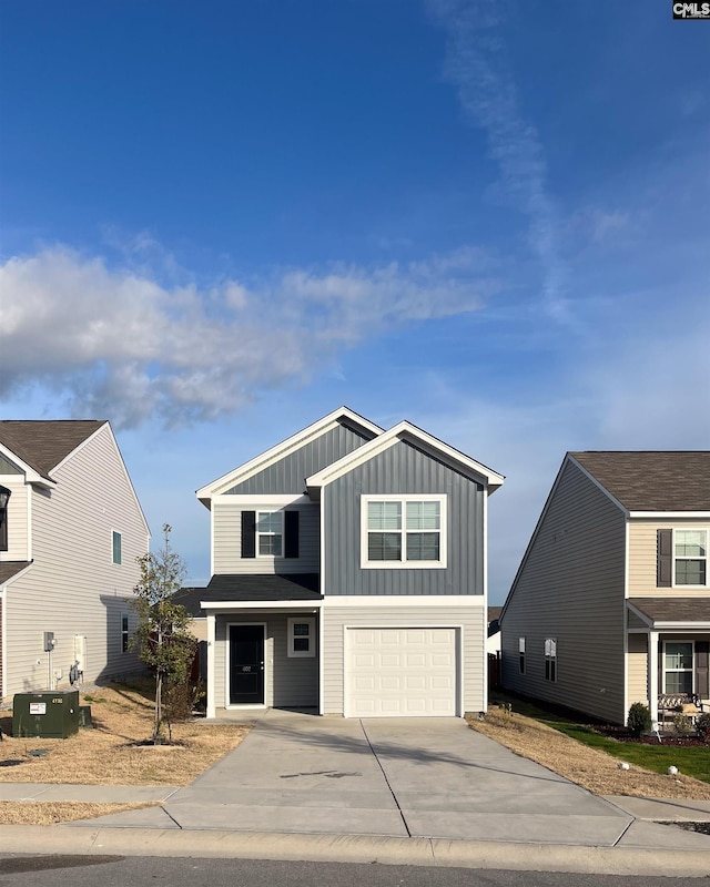 407 Eclipse Ln, Elgin, SC 29045 - view of front of home with board and batten siding, driveway, a garage, and central AC