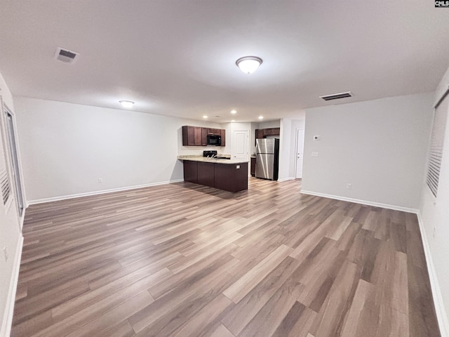 407 Eclipse Ln, Elgin, SC 29045 - unfurnished living room featuring light wood-style floors, baseboards, and recessed lighting