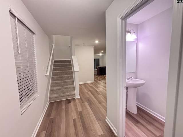 407 Eclipse Ln, Elgin, SC 29045 - hall with wood finished floors, stairway, baseboards, recessed lighting, and a sink