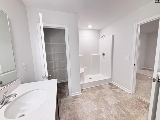 407 Eclipse Ln, Elgin, SC 29045 - full bath with a walk in shower, baseboards, stone finish floors, and vanity