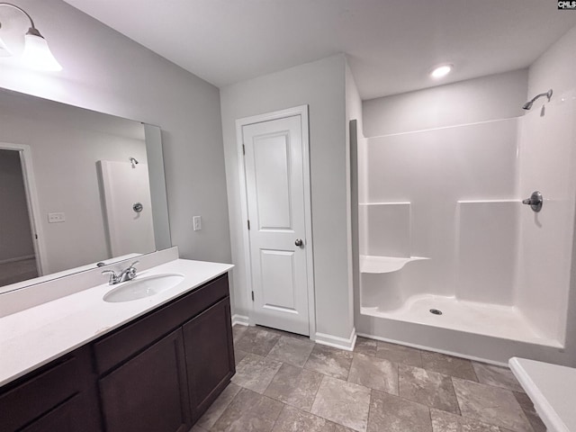 407 Eclipse Ln, Elgin, SC 29045 - bathroom featuring a shower, vanity, baseboards, and stone finish flooring