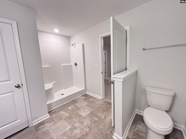 407 Eclipse Ln, Elgin, SC 29045 - full bath featuring baseboards, a shower, toilet, stone finish floors, and recessed lighting