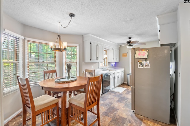 200 Kemsing Rd, Columbia, SC 29212 - dining space featuring a textured ceiling, a ceiling fan, and a chandelier