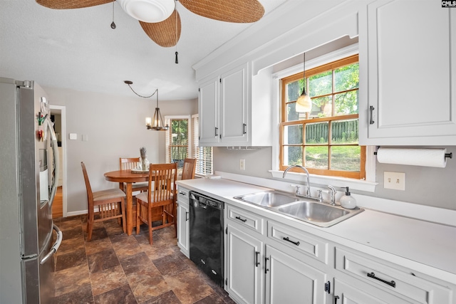 200 Kemsing Rd, Columbia, SC 29212 - kitchen featuring black dishwasher, freestanding refrigerator, a sink, white cabinets, and decorative light fixtures