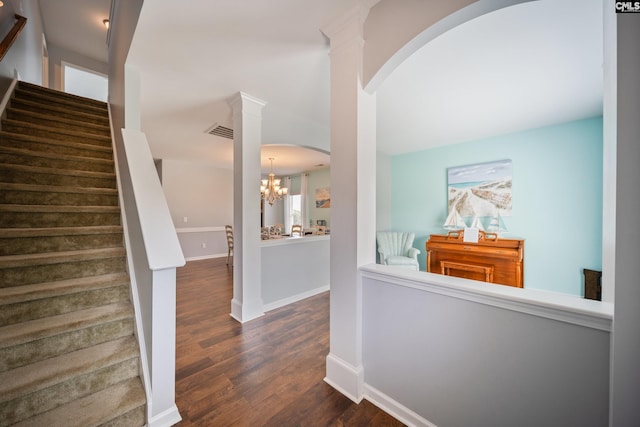 415 Mulberry Ridge Ct, Lexington, SC 29073 - hallway with arched walkways, stairs, wood finished floors, baseboards, and a chandelier