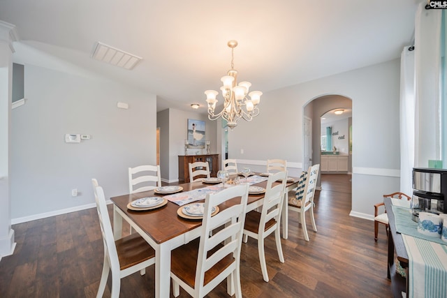415 Mulberry Ridge Ct, Lexington, SC 29073 - dining room featuring arched walkways, a chandelier, wood finished floors, and baseboards