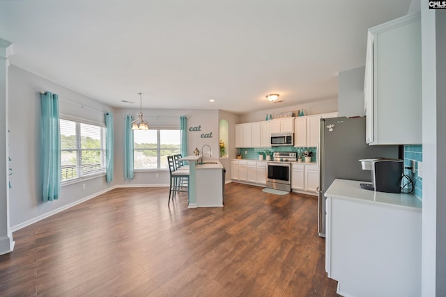 415 Mulberry Ridge Ct, Lexington, SC 29073 - kitchen with appliances with stainless steel finishes, a sink, light countertops, dark wood-style floors, and backsplash
