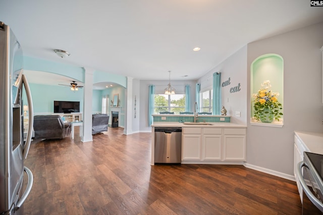 415 Mulberry Ridge Ct, Lexington, SC 29073 - kitchen with stainless steel appliances, a sink, ceiling fan, dark wood-type flooring, and white cabinets