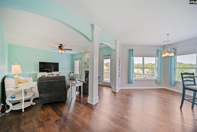 415 Mulberry Ridge Ct, Lexington, SC 29073 - living room with arched walkways, dark wood-style floors, a ceiling fan, and baseboards