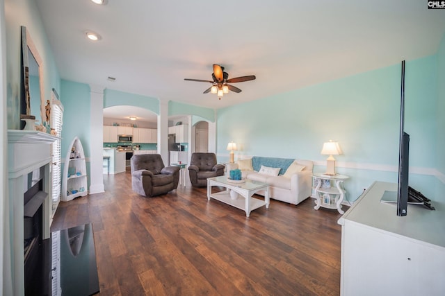 415 Mulberry Ridge Ct, Lexington, SC 29073 - living room with arched walkways, decorative columns, a ceiling fan, and dark wood-style floors