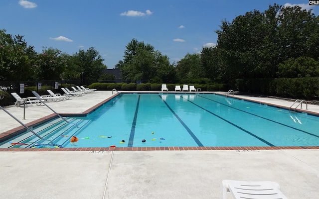 415 Mulberry Ridge Ct, Lexington, SC 29073 - community pool featuring a patio area, fence, and view of wooded area
