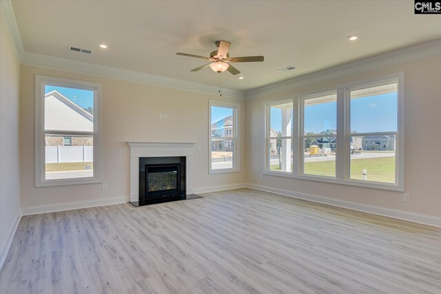 550 Edenwood Dr, Sumter, SC 29150 - unfurnished living room with crown molding, light wood-style floors, a ceiling fan, baseboards, and a glass covered fireplace