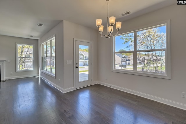 550 Edenwood Dr, Sumter, SC 29150 - unfurnished dining area with baseboards, a chandelier, and dark wood-style flooring