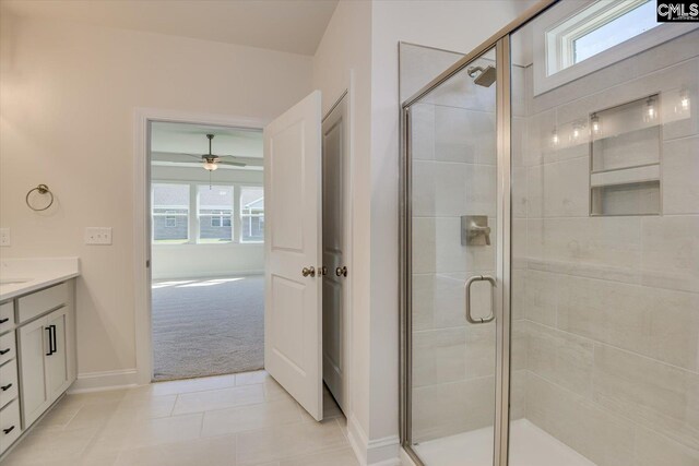 550 Edenwood Dr, Sumter, SC 29150 - full bathroom with a stall shower, vanity, a ceiling fan, baseboards, and tile patterned floors