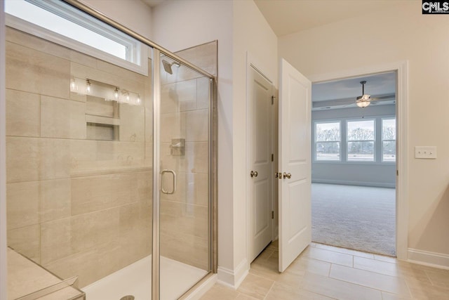 550 Edenwood Dr, Sumter, SC 29150 - full bathroom featuring a stall shower, ceiling fan, tile patterned flooring, and baseboards