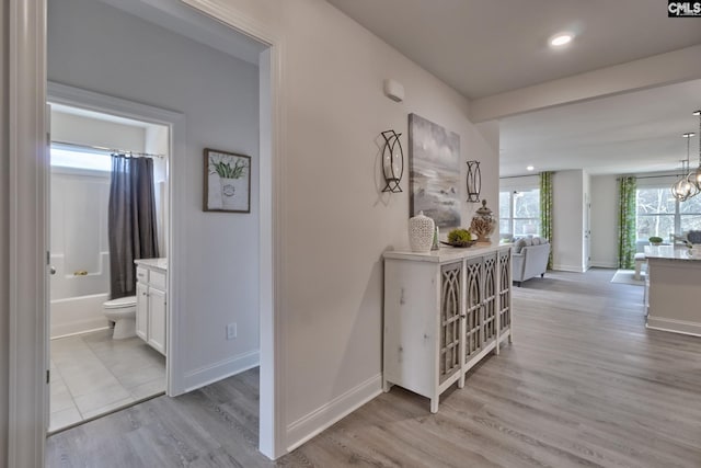 550 Edenwood Dr, Sumter, SC 29150 - hallway with light wood-style floors, baseboards, a chandelier, and recessed lighting