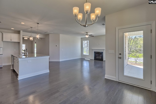 550 Edenwood Dr, Sumter, SC 29150 - kitchen with a sink, white cabinets, baseboards, pendant lighting, and recessed lighting