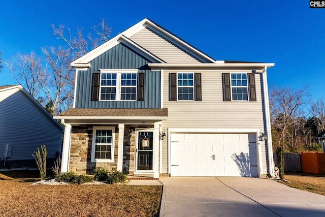 520 Connecticut Ave, Chapin, SC 29036 - view of front of home with concrete driveway, a garage, board and batten siding, fence, and stone siding