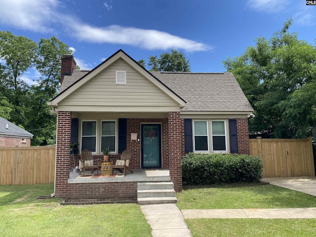 2924 Hope Ave, Columbia, SC 29205 - bungalow with covered porch, brick siding, a chimney, and a shingled roof