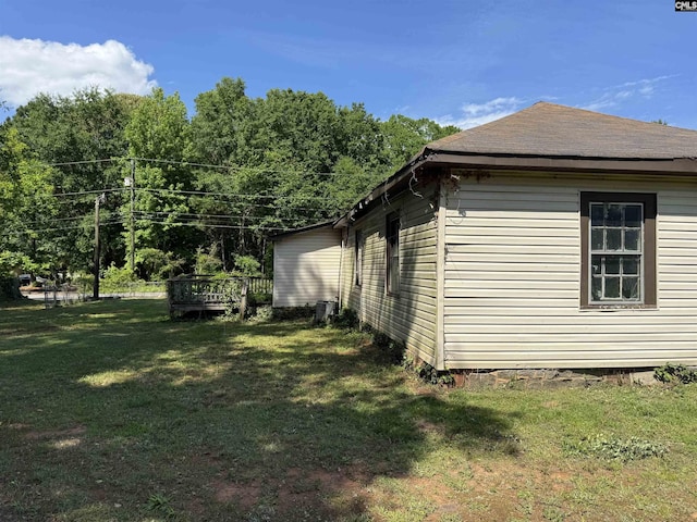 382 Fagan Rd, Winnsboro, SC 29180 - view of side of home featuring a lawn, central air condition unit, and a wooden deck
