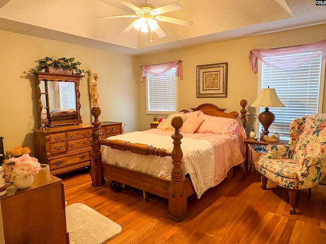 bedroom featuring wood finished floors and ceiling fan