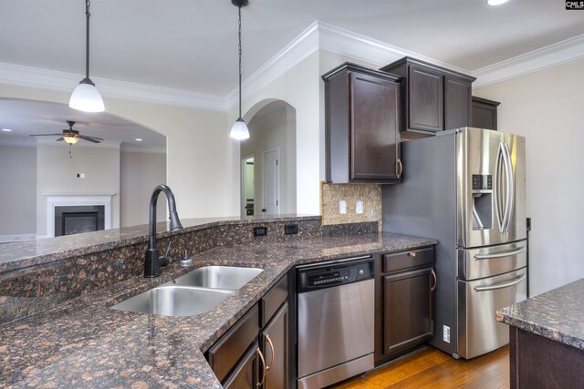 680 Curlew Cir, Sumter, SC 29150 - kitchen with stainless steel appliances, arched walkways, a sink, wood finished floors, and ceiling fan