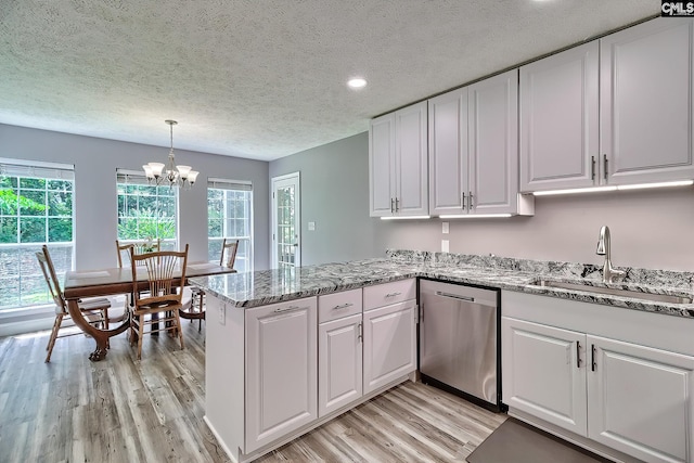 1240 Windmill Rd, Leesville, SC 29070 - kitchen with dishwasher, a sink, light wood finished floors, white cabinets, and a textured ceiling