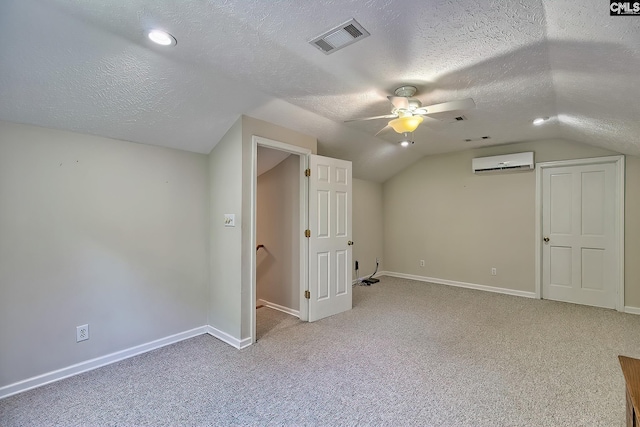 1240 Windmill Rd, Leesville, SC 29070 - bonus room featuring an AC wall unit, vaulted ceiling, carpet, baseboards, and a ceiling fan