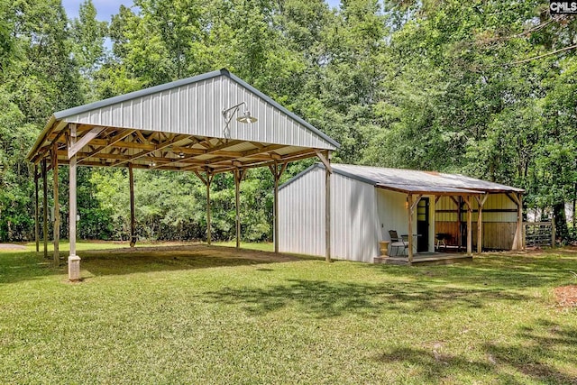 1240 Windmill Rd, Leesville, SC 29070 - view of grassy yard with a carport, an outbuilding, an outdoor structure, and view of wooded area