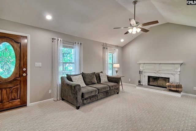 1240 Windmill Rd, Leesville, SC 29070 - living room featuring a ceiling fan, lofted ceiling, light carpet, a fireplace, and baseboards