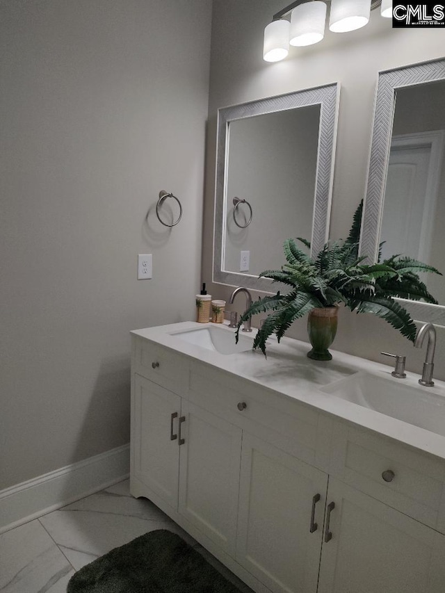 10 Saints Creek Pl, Irmo, SC 29063 - bathroom featuring double vanity, marble look tiles, and baseboards