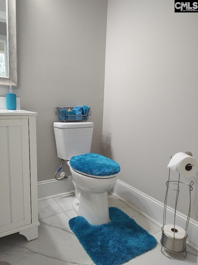 10 Saints Creek Pl, Irmo, SC 29063 - bathroom featuring toilet, vanity, marble look tile flooring, and baseboards