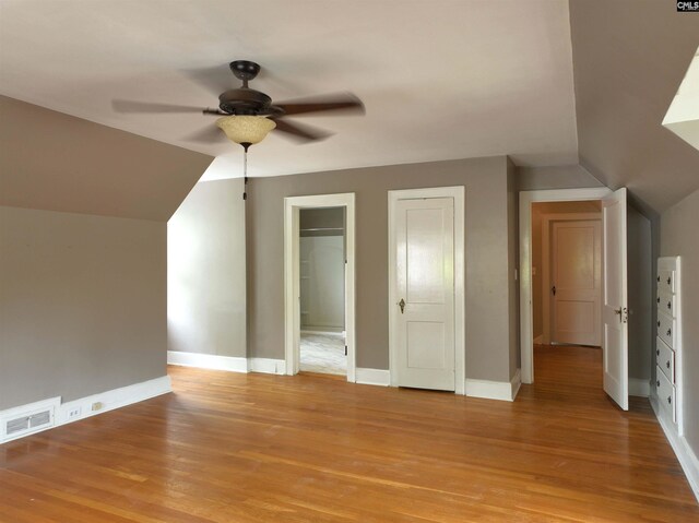 3925 Rosewood Dr, Columbia, SC 29205 - additional living space featuring a ceiling fan, vaulted ceiling, light wood-style floors, and baseboards