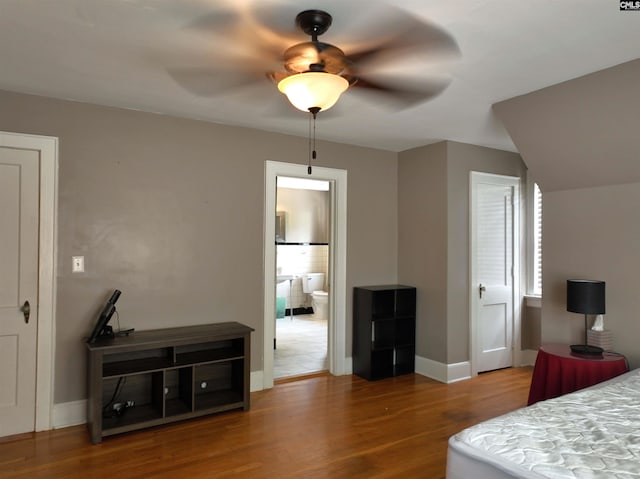 3925 Rosewood Dr, Columbia, SC 29205 - bedroom with wood finished floors, baseboards, ceiling fan, and ensuite bath
