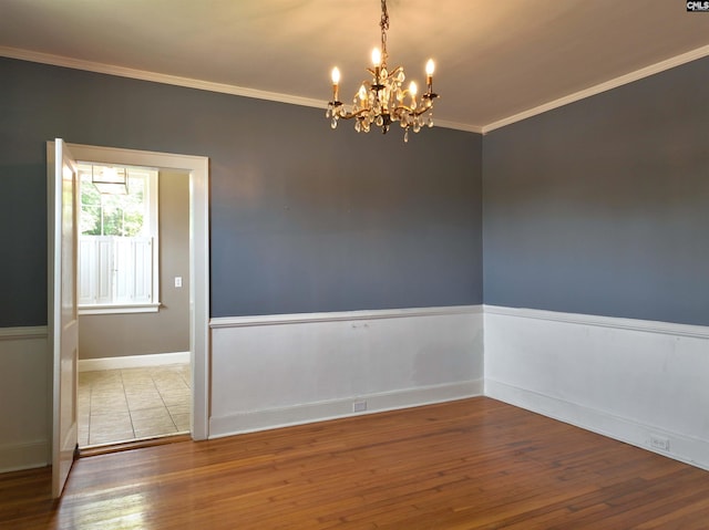 3925 Rosewood Dr, Columbia, SC 29205 - unfurnished room featuring a chandelier, wood-type flooring, ornamental molding, and baseboards