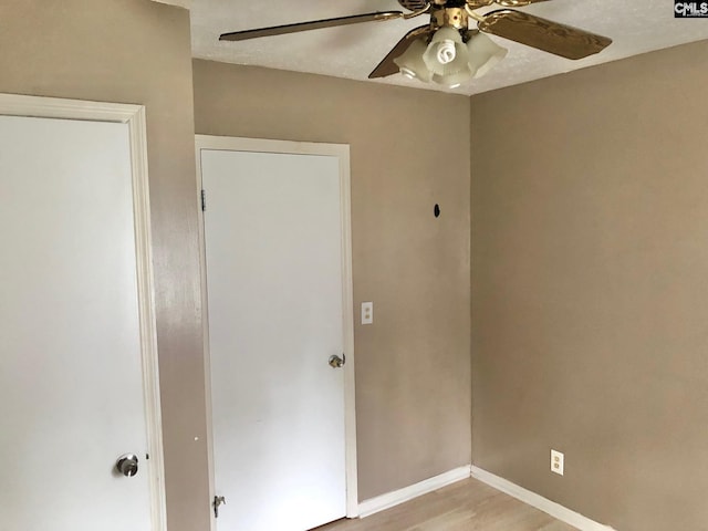 1171 Indian Creek Pt, Saluda, SC 29138 - unfurnished bedroom with ceiling fan, baseboards, and light wood-style flooring