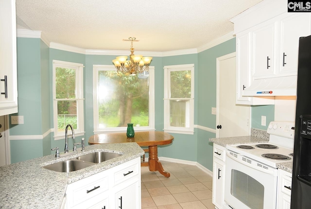 kitchen with white electric range oven, a sink, a chandelier, black fridge, and white cabinetry