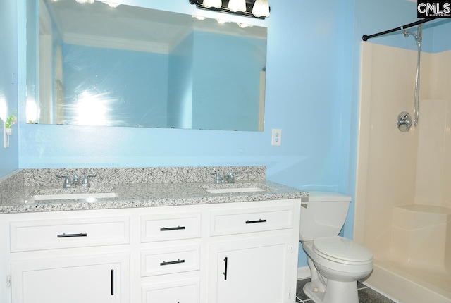 full bath with a shower stall, toilet, and double vanity