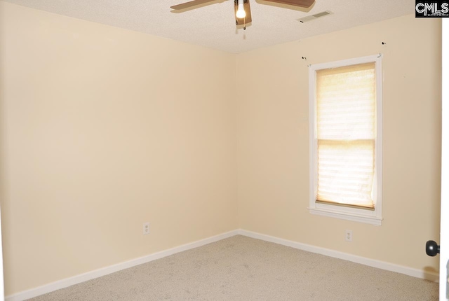 unfurnished room featuring ceiling fan, carpet, and baseboards