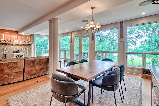 109 Broad Bluff Pt, Irmo, SC 29063 - dining space with decorative columns, light wood-style floors, a chandelier, and recessed lighting