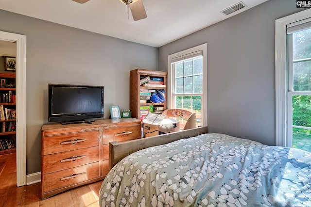 109 Broad Bluff Pt, Irmo, SC 29063 - bedroom with light wood-style flooring, multiple windows, and ceiling fan