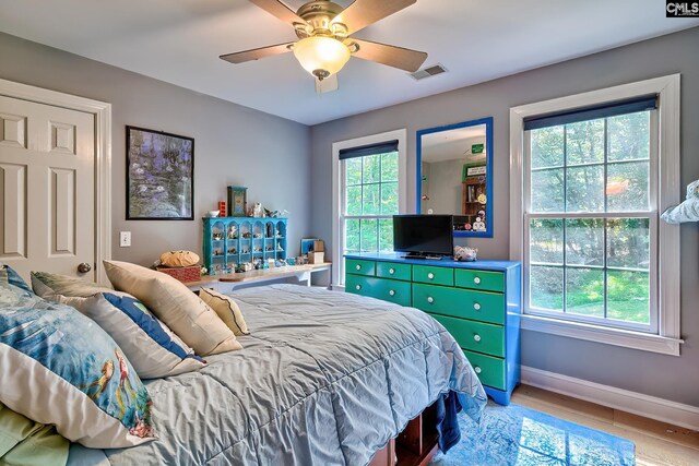 109 Broad Bluff Pt, Irmo, SC 29063 - bedroom with baseboards, light wood-type flooring, and ceiling fan