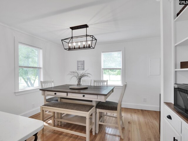 1513 Molly Creek Cir, Ridgeway, SC 29130 - dining area featuring crown molding, healthy amount of natural light, light wood-type flooring, and baseboards